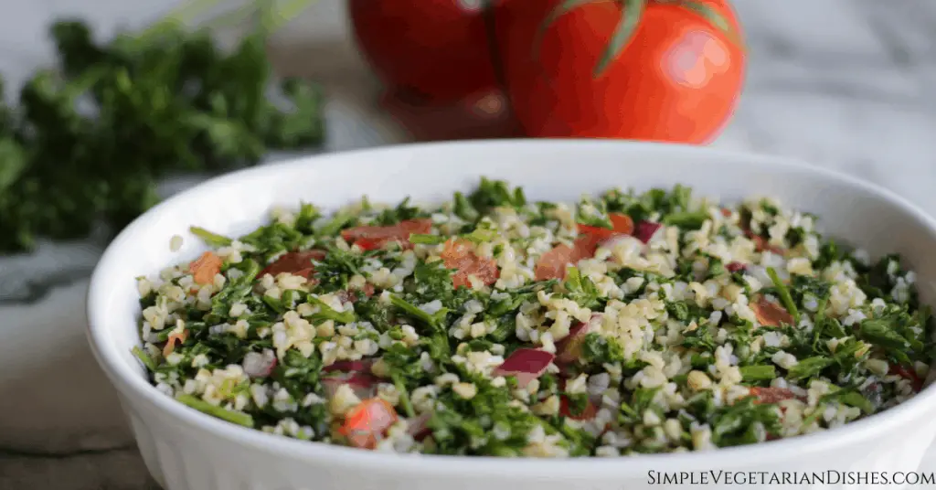 taboule salad in white serving dish