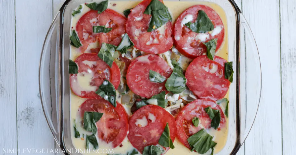 crustless tomato pie with quiche filling poured over it