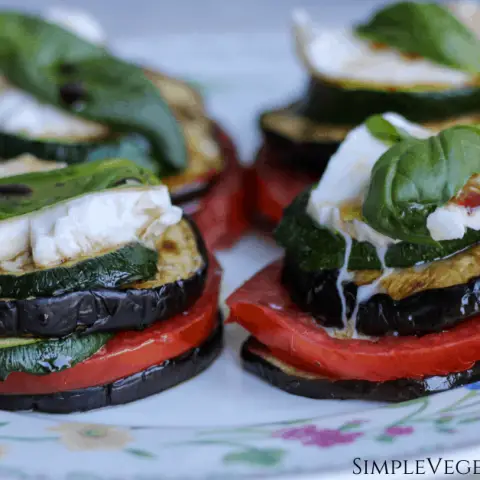 four eggplant napoleons on floral plate