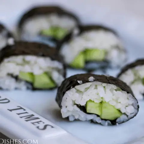 white platter of kappa maki cucumber sushi