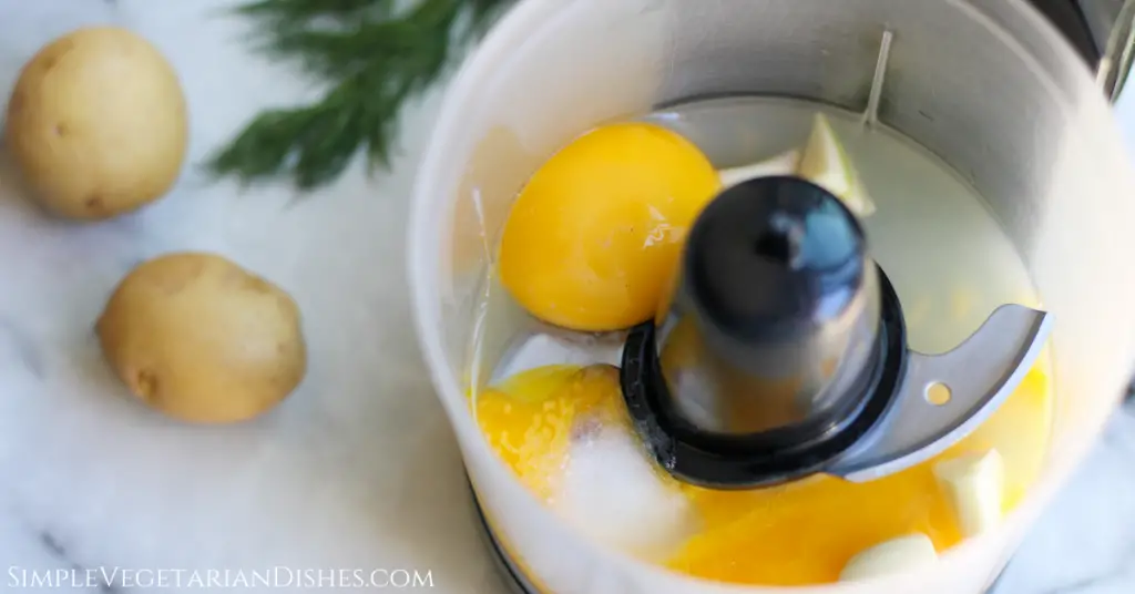 egg yolks, garlic, salt, and lemon juice in food processor for base of harissa aioli