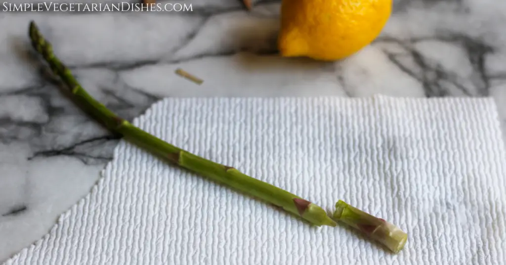 you can snap the ends off your asparagus instead of trimming example asparagus spear on paper towel with end snapped off