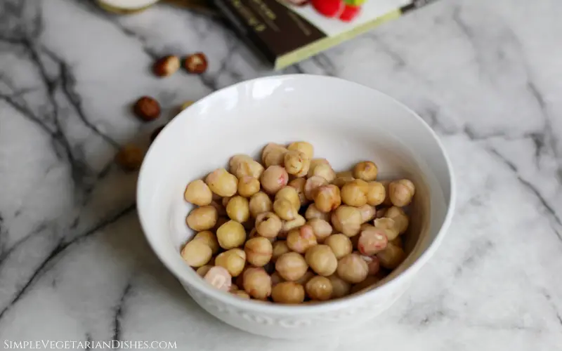 blanched and peeled hazelnuts in white bowl