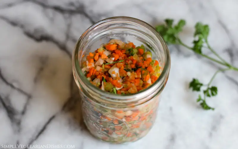 battuto in mason jar on white marble table