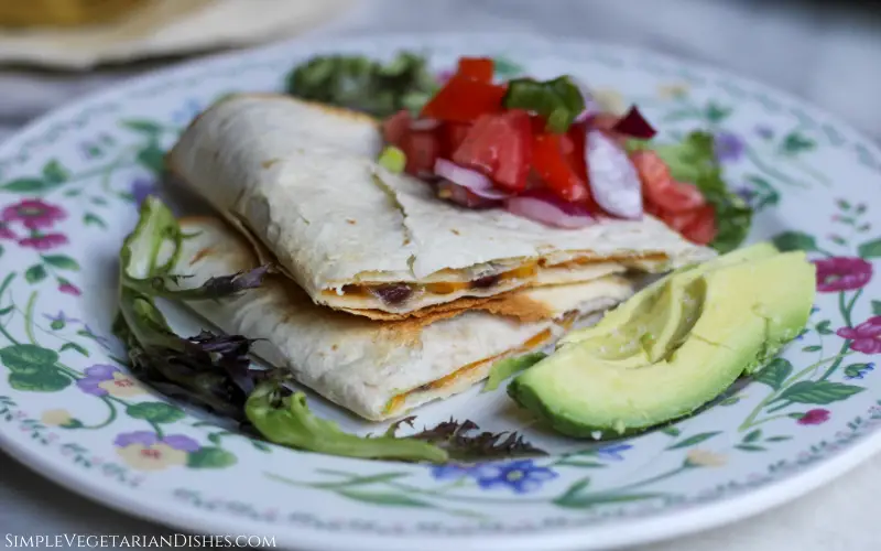 air fried quesadillas served with avocado lettuce and pico de Gallo