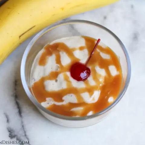 frozen banana swirl served with maraschino cherry in glass dish