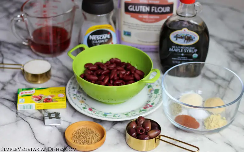 kidney beans, vital wheat gluten flour, kalamata olives, spices, instant coffee on white marble table