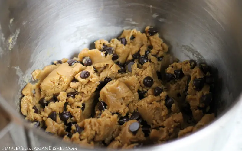 high altitude chocolate chip cookie dough in stainless steel mixing bowl