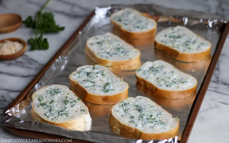 vegan garlic bread pre-cheese on foil lined baking sheet