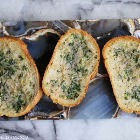 vegan garlic bread served on grey agate cheese board