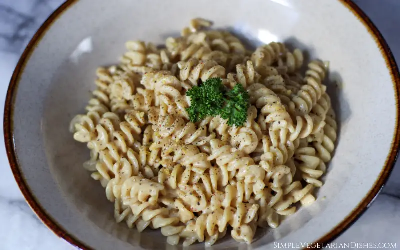 vegan cacio e pepe with parsley nutritional yeast and pepper