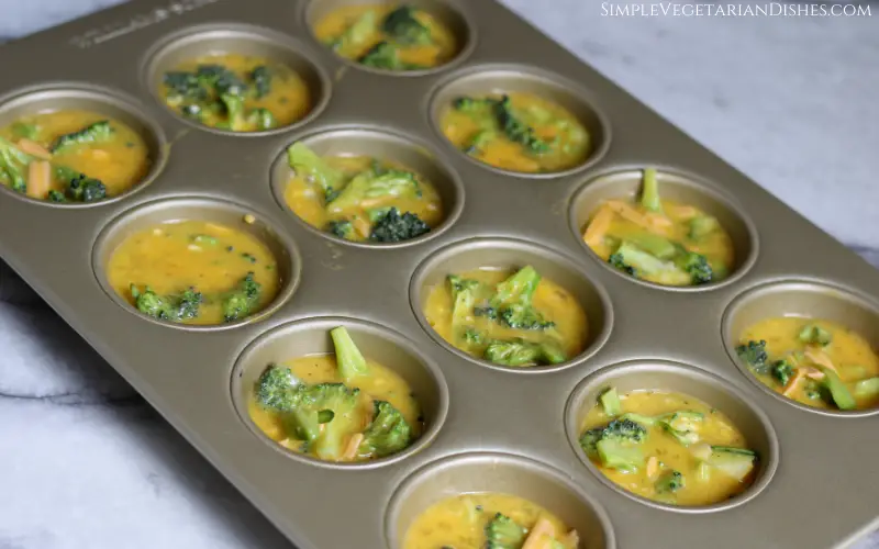 broccoli frittata muffins in tin before cheese or baking