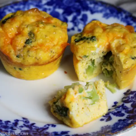 broccoli frittata muffins cut and served on blue china