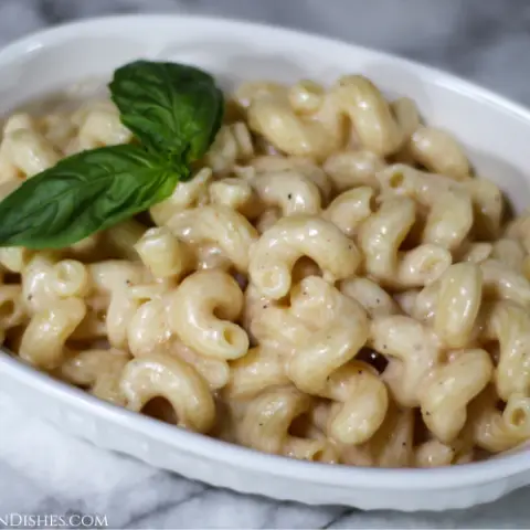 Gouda Mac and cheese in white dish with basil