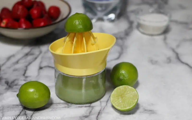 juicing limes with citrus squeezer cup