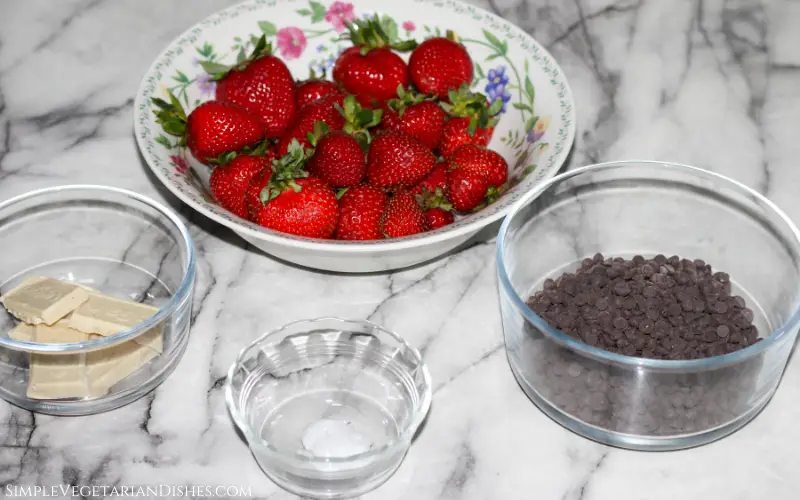 floral bowl of berries with candy for coating in glass bowls