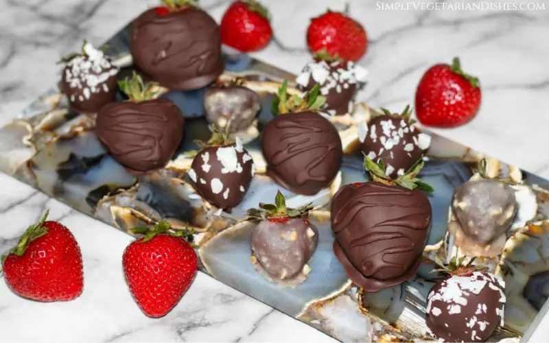 vegan chocolate covered strawberries on gray agate cheeseboard
