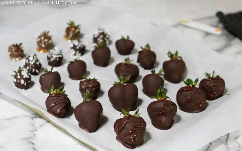 vegan chocolate covered strawberries with wet stripes of chocolate