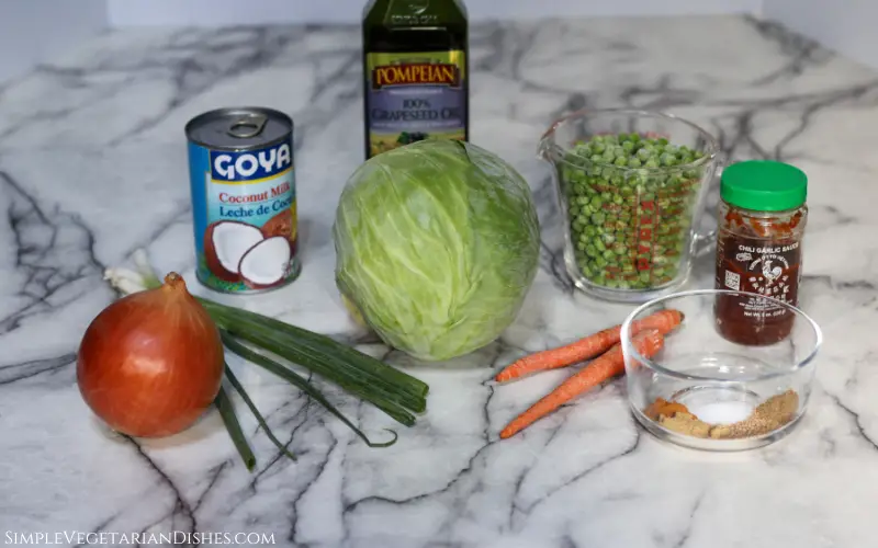 cabbage onion green onion carrots spices peas coconut milk oil and garlic chili sauce