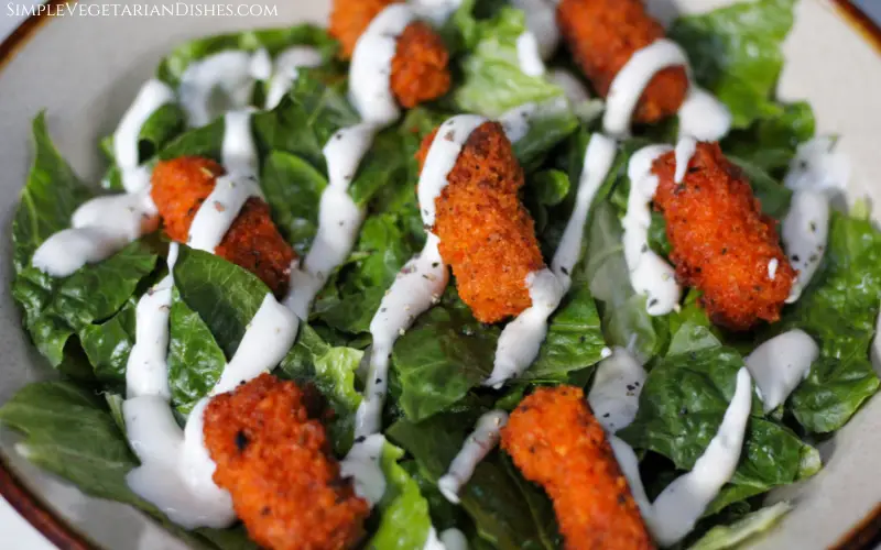 baked buffalo tofu wings served in salad