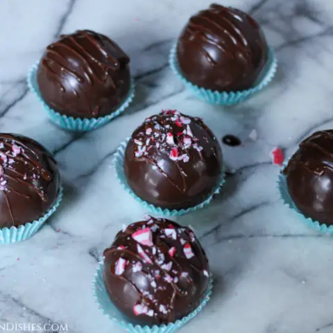 vegan hot chocolate bombs decorated with crushed candy cane pieces