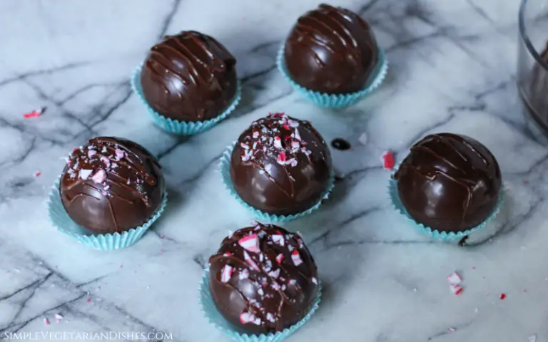 vegan hot chocolate bombs decorated with crushed candy cane pieces