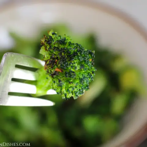 floret of frozen broccoli cooked in the air fryer on a fork