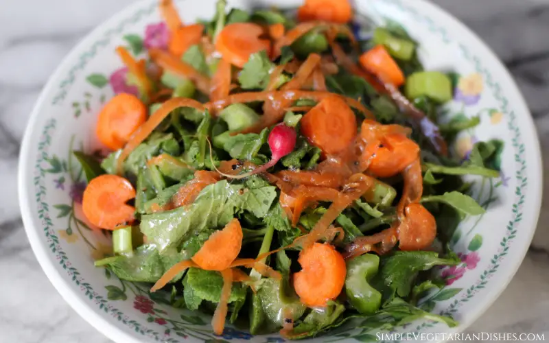 salad with greens, celery, and carrots