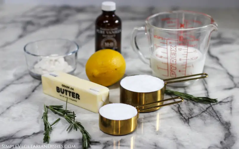 ingredients to make vanilla icing on white marble table