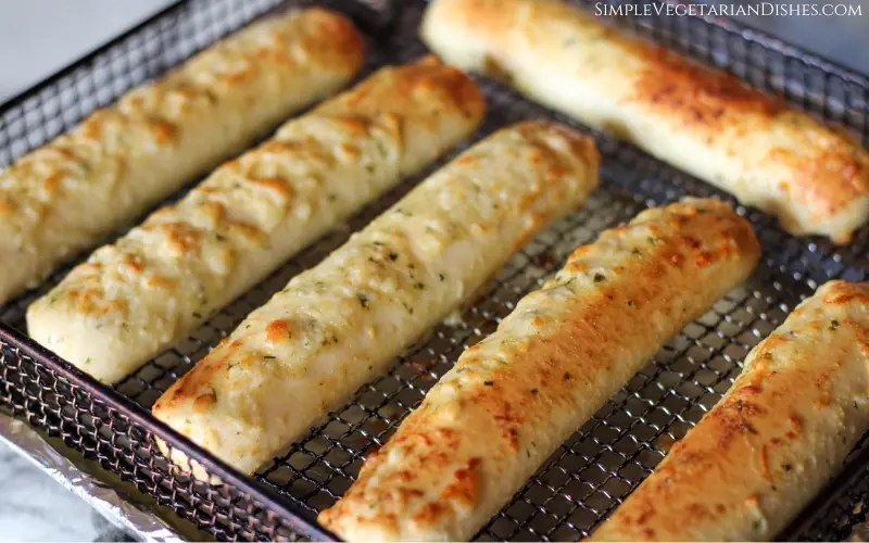 frozen bread sticks in air fryer basket done and golden brown