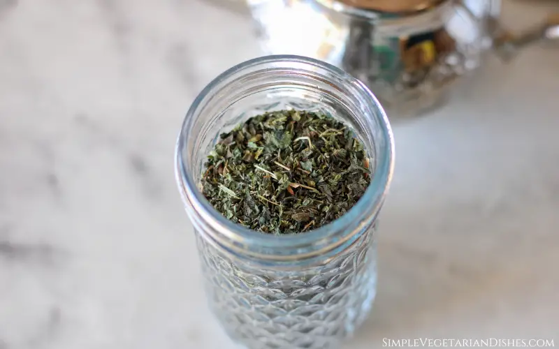 dried stinging nettle leaves in glass jar